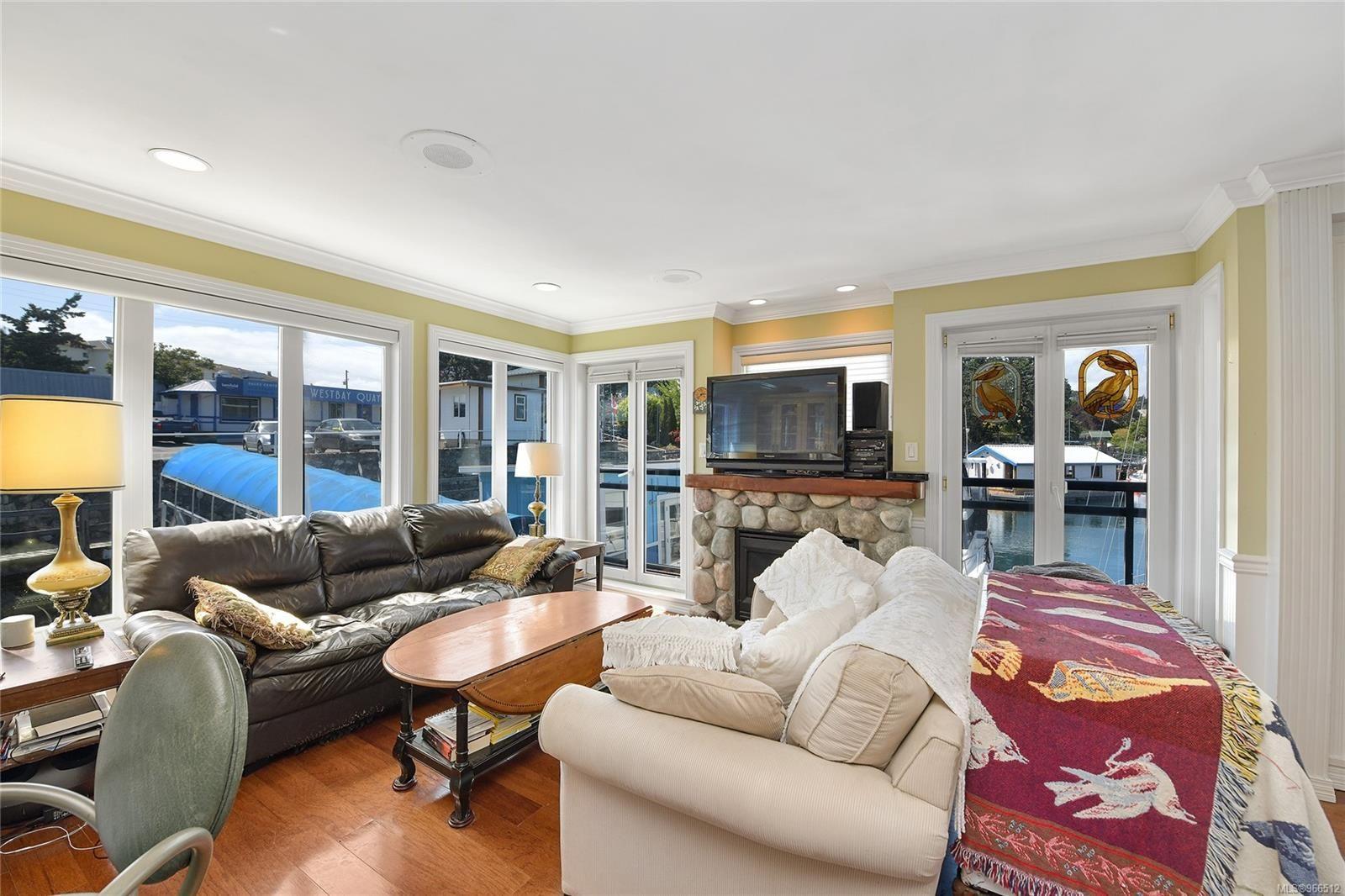 Cozy living room in a 2005 custom float home with waterfront views and comfortable seating.