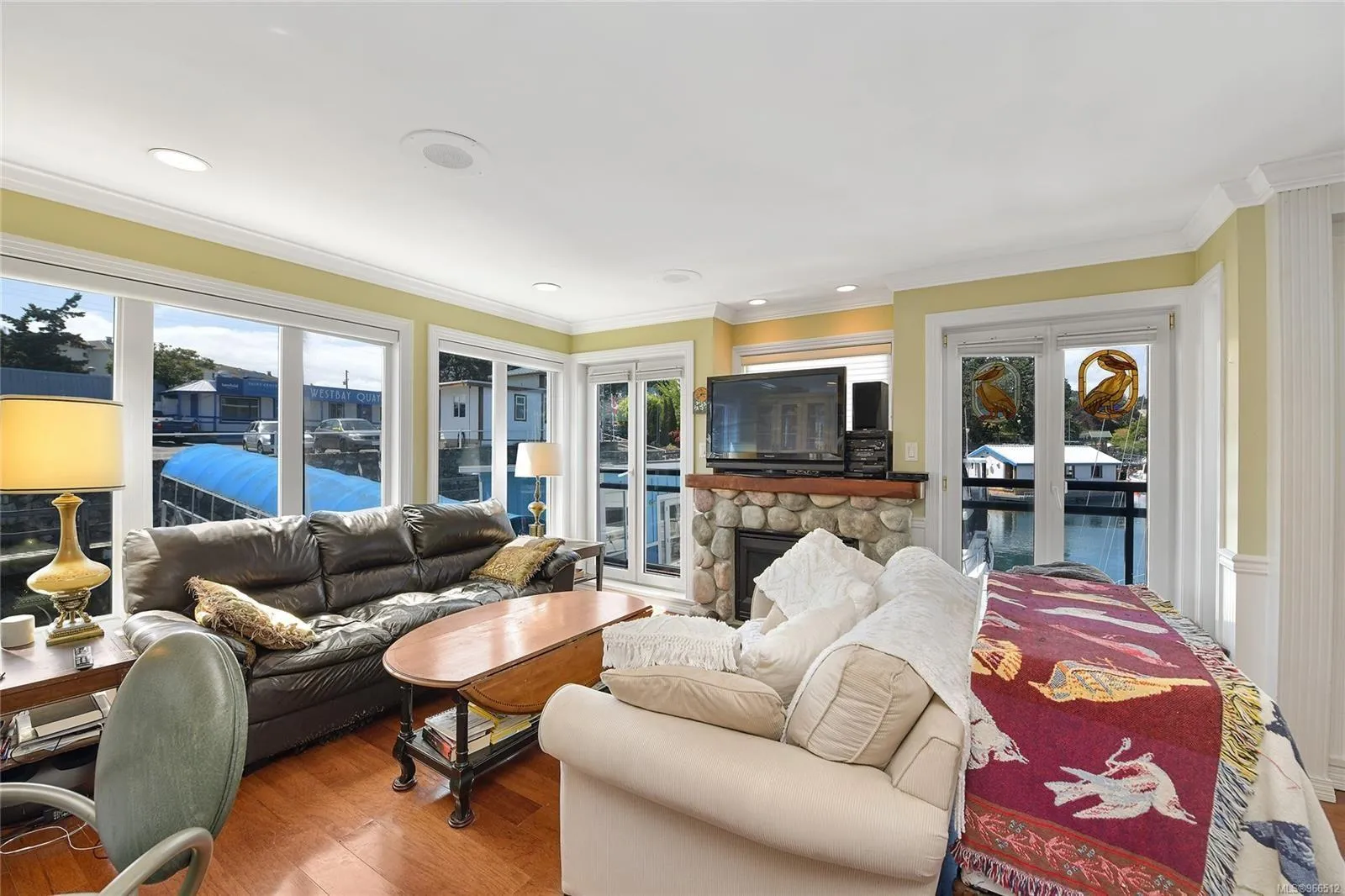 Cozy living room in a 2005 custom float home with waterfront views and comfortable seating.