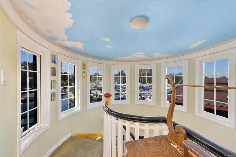  Yacht Photos Pics Circular room with sky-painted ceiling, large windows, and spiral staircase in a 2005 custom float home.