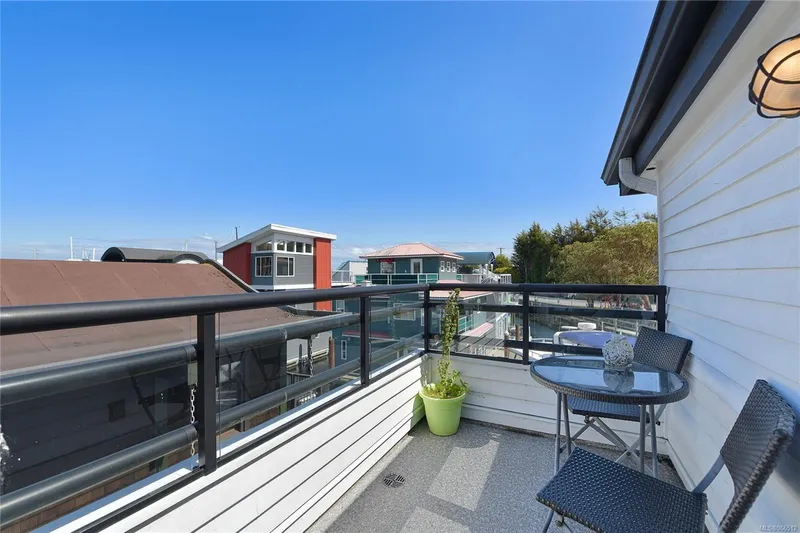  Yacht Photos Pics Rooftop patio on a 2005 Custom Float Home with seating, glass railing, and ocean view.