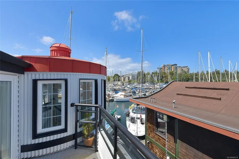  Yacht Photos Pics Custom 2005 float home with marina view, featuring boats and clear blue sky.