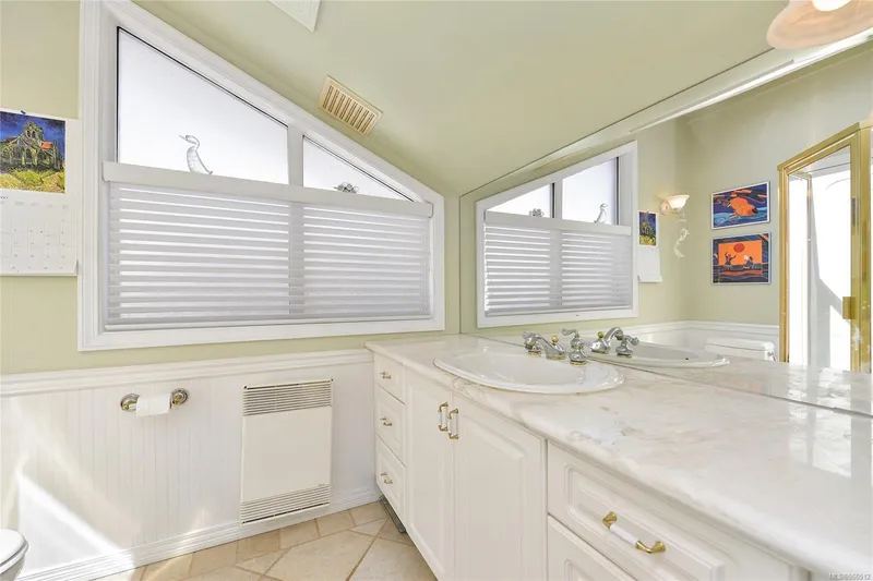  Yacht Photos Pics Bright bathroom in 2005 Custom Float Home with dual sinks and large mirrors.