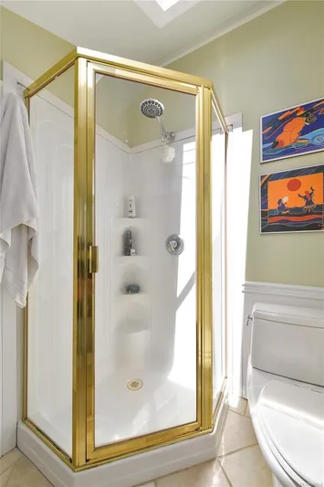  Yacht Photos Pics Compact shower with gold trim in a 2005 custom float home bathroom.