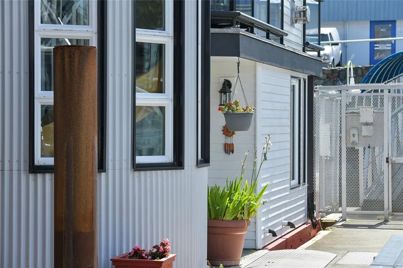  Yacht Photos Pics Custom 2005 float home with potted plants and hanging lantern.