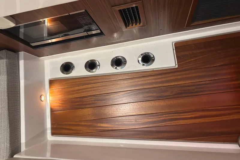  Yacht Photos Pics Interior of 2020 Pursuit DC 365 Dual Console with wood paneling and lighting.