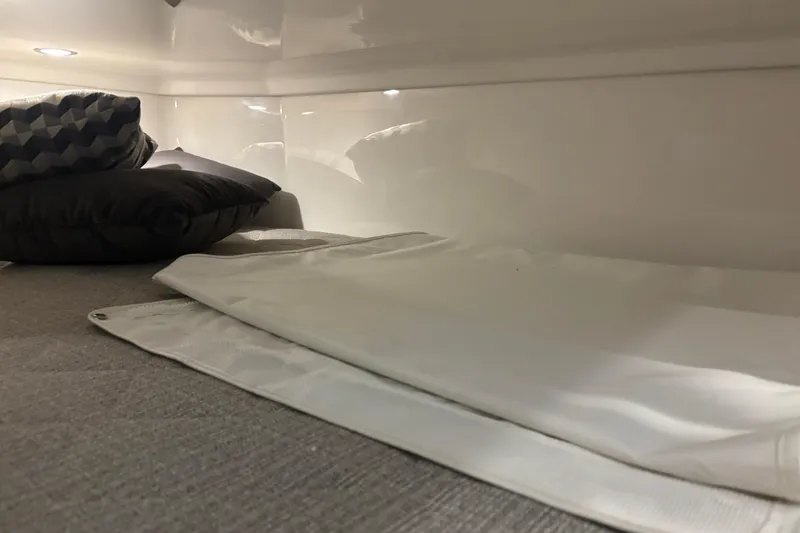  Yacht Photos Pics Interior cabin of 2020 Pursuit DC 365 Dual Console with pillows and bedding.