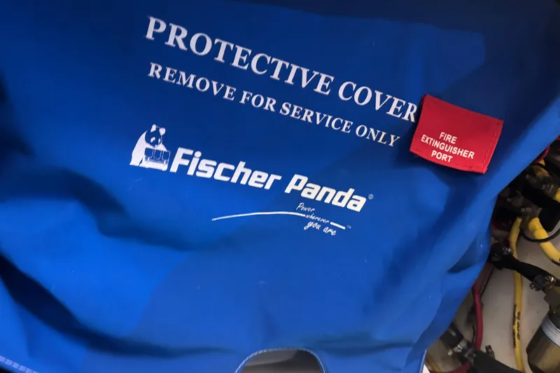  Yacht Photos Pics Blue Fischer Panda protective cover with fire extinguisher port on Pursuit DC 365 Dual Console.