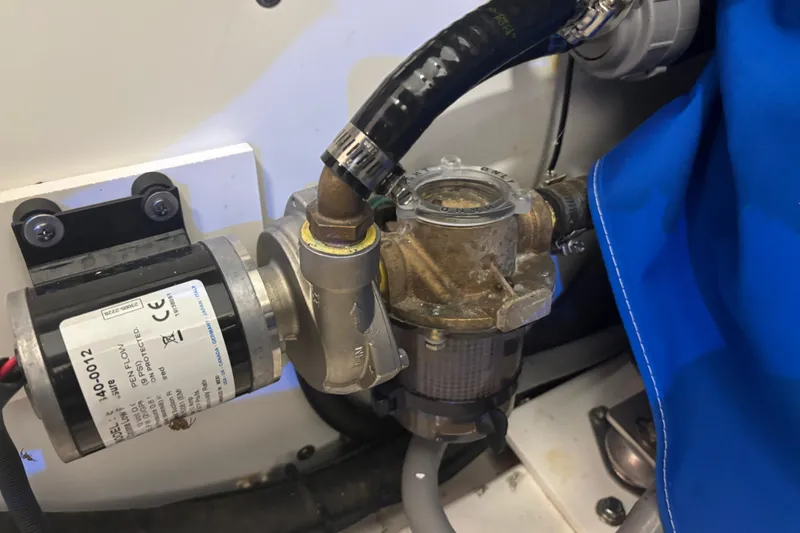  Yacht Photos Pics Engine compartment of 2020 Pursuit DC 365 Dual Console with visible pump and hoses.