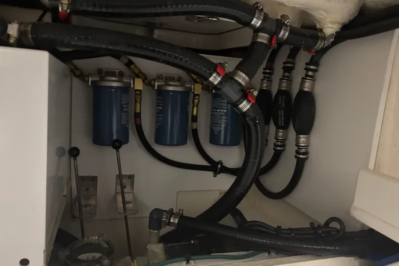  Yacht Photos Pics Engine compartment of 2020 Pursuit DC 365 Dual Console with fuel filters and hoses.