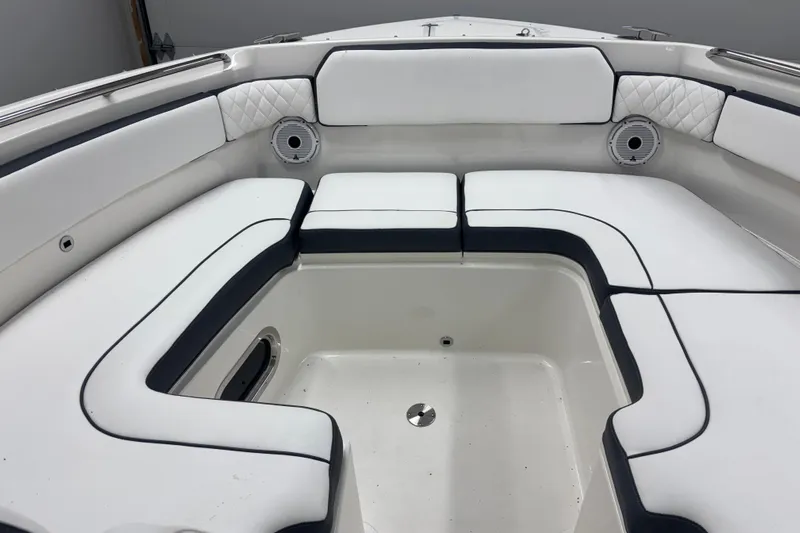  Yacht Photos Pics 2020 Pursuit DC 365 Dual Console boat interior with white cushioned seating and speakers.