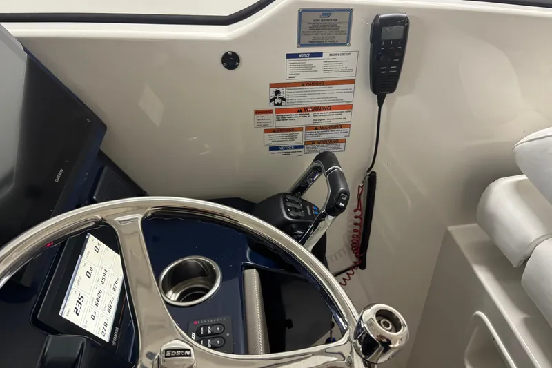  Yacht Photos Pics 2020 Pursuit DC 365 Dual Console helm with steering wheel, controls, and display.