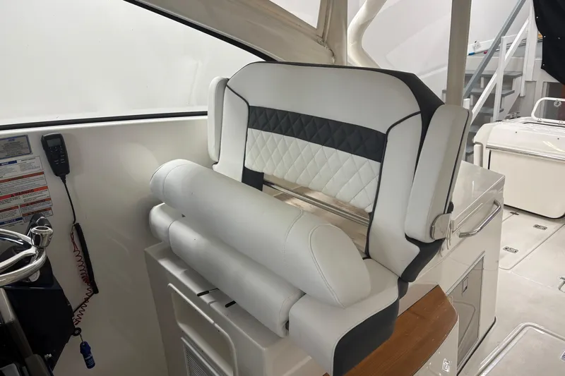  Yacht Photos Pics 2020 Pursuit DC 365 Dual Console boat interior with luxurious seating and control panel.