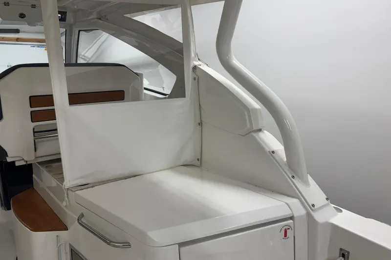  Yacht Photos Pics 2020 Pursuit DC 365 Dual Console interior with sleek white design and seating area.