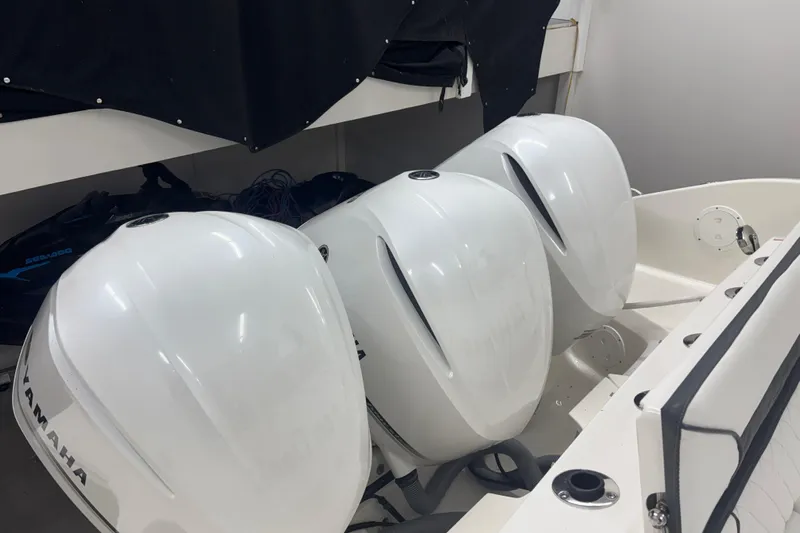  Yacht Photos Pics 2020 Pursuit DC 365 Dual Console with triple Yamaha outboard engines in storage.