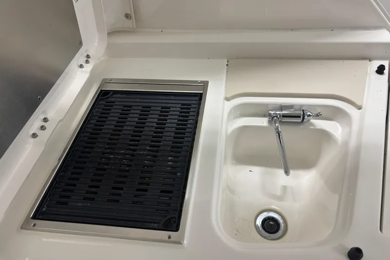  Yacht Photos Pics 2020 Pursuit DC 365 Dual Console boat sink and grill area.