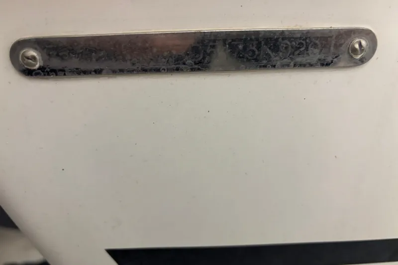  Yacht Photos Pics 2020 Pursuit DC 365 Dual Console boat identification plate, close-up view.