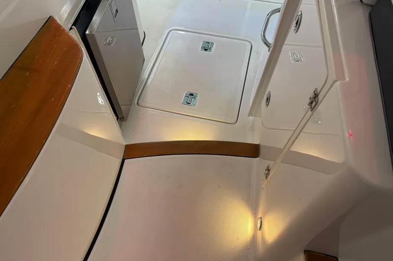  Yacht Photos Pics 2020 Pursuit DC 365 Dual Console interior with storage compartments and sleek design.