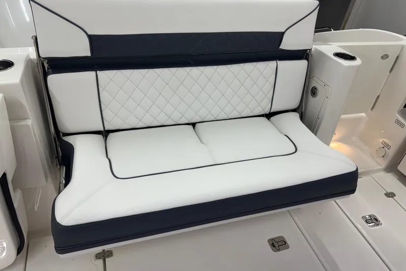  Yacht Photos Pics 2020 Pursuit DC 365 Dual Console boat seat with white and navy upholstery.