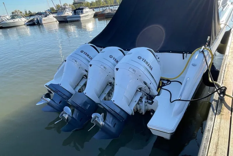  Yacht Photos Pics 2020 Pursuit DC 365 Dual Console with triple Yamaha outboard engines docked.