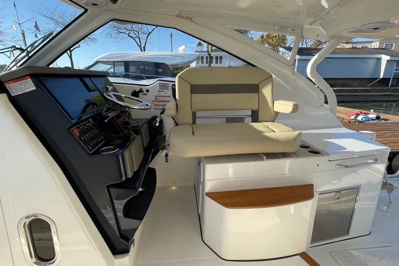  Yacht Photos Pics 2020 Pursuit DC 365 Dual Console boat interior with helm and seating area.
