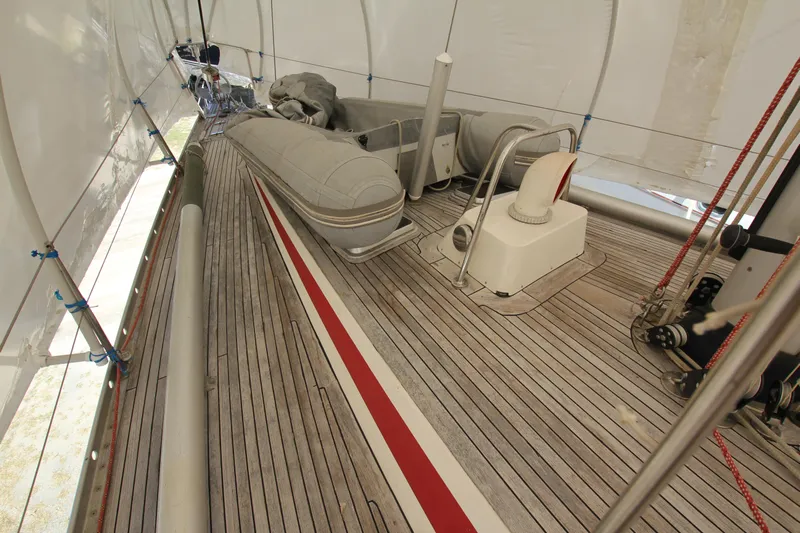 Le Reve Yacht Photos Pics Deck of 1983 Nautor Swan 46mkI yacht with inflatable dinghy and wooden flooring.