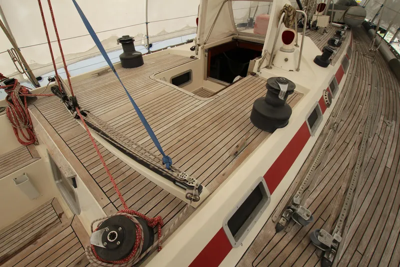 Le Reve Yacht Photos Pics Deck view of 1983 Nautor Swan 46mkI sailboat, featuring teak wood and winches.