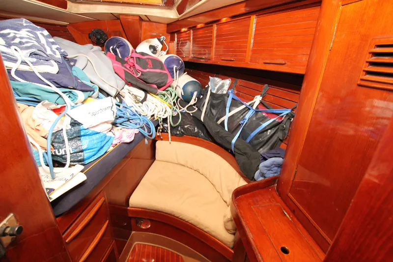 Le Reve Yacht Photos Pics Cozy cabin interior of 1983 Nautor Swan 46mkI yacht with wooden finish and storage.