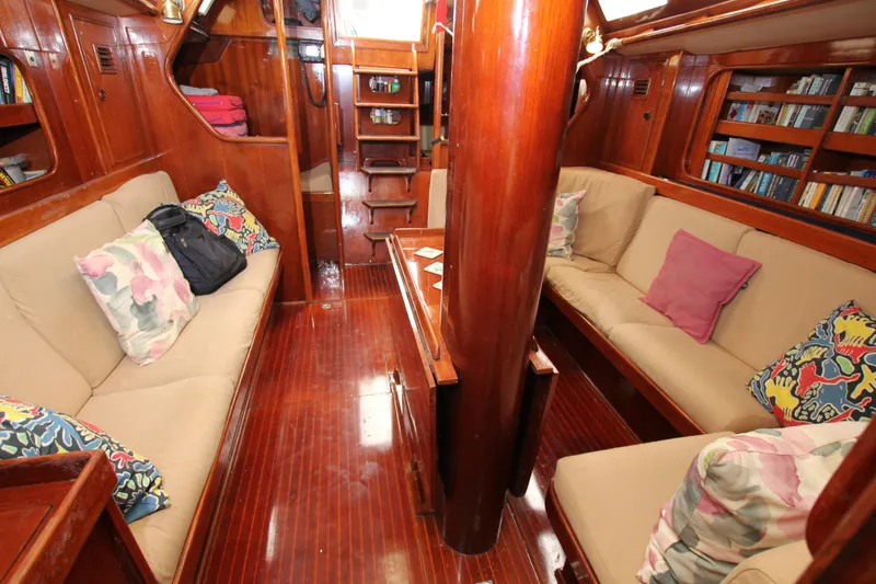 Le Reve Yacht Photos Pics Luxurious 1983 Nautor Swan 46mkI yacht interior with cozy seating and vibrant cushions.