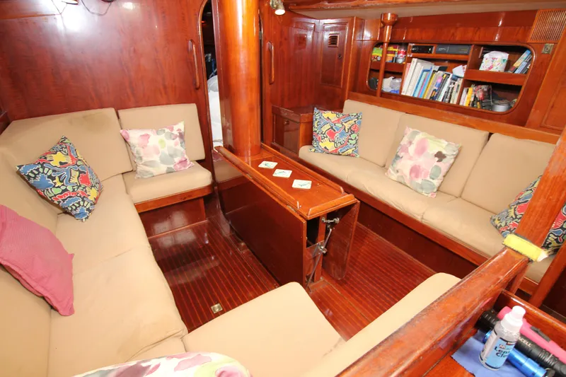 Le Reve Yacht Photos Pics Interior of 1983 Nautor Swan 46mkI yacht with cozy seating and colorful cushions.