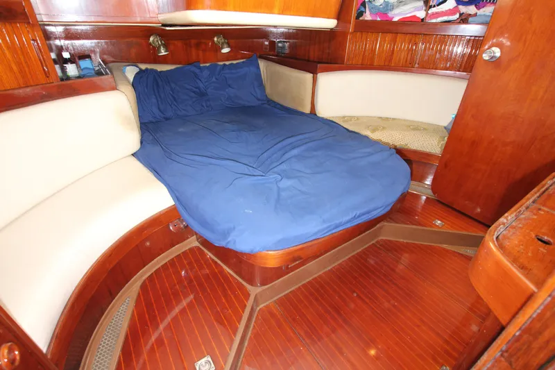 Le Reve Yacht Photos Pics Cozy cabin interior of 1983 Nautor Swan 46mkI yacht with blue bedding.
