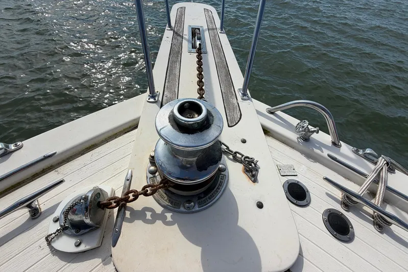 Frayed Knot Yacht Photos Pics Anchor winch on 1987 Viking 44 Motor Yacht deck, with ocean view.