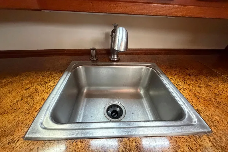 Frayed Knot Yacht Photos Pics Stainless steel sink in 1987 Viking 44 Motor Yacht kitchen area.