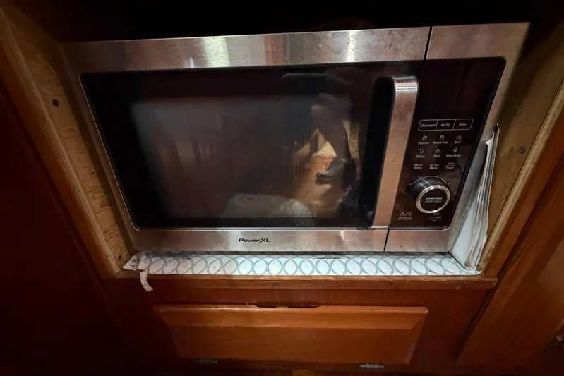 Frayed Knot Yacht Photos Pics Microwave oven in 1987 Viking 44 Motor Yacht kitchen area.