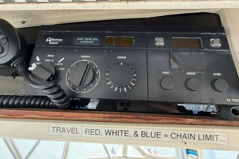 Frayed Knot Yacht Photos Pics Autopilot control panel on 1987 Viking 44 Motor Yacht with microphone and navigation settings.