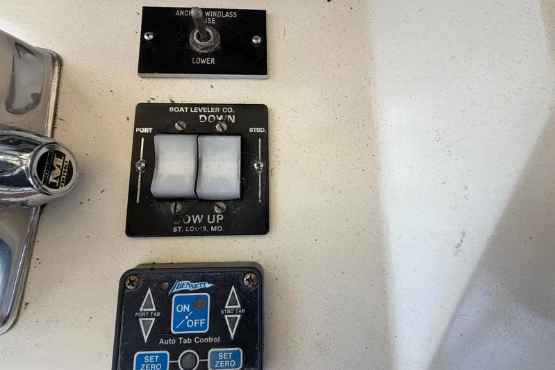 Frayed Knot Yacht Photos Pics Control panel of a 1987 Viking 44 Motor Yacht with switches and buttons.