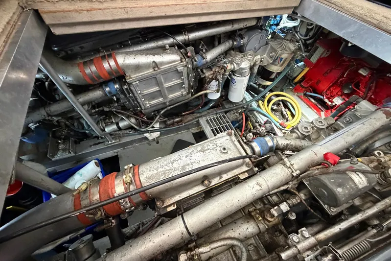 Frayed Knot Yacht Photos Pics Engine room of a 1987 Viking 44 Motor Yacht, showcasing complex machinery and components.