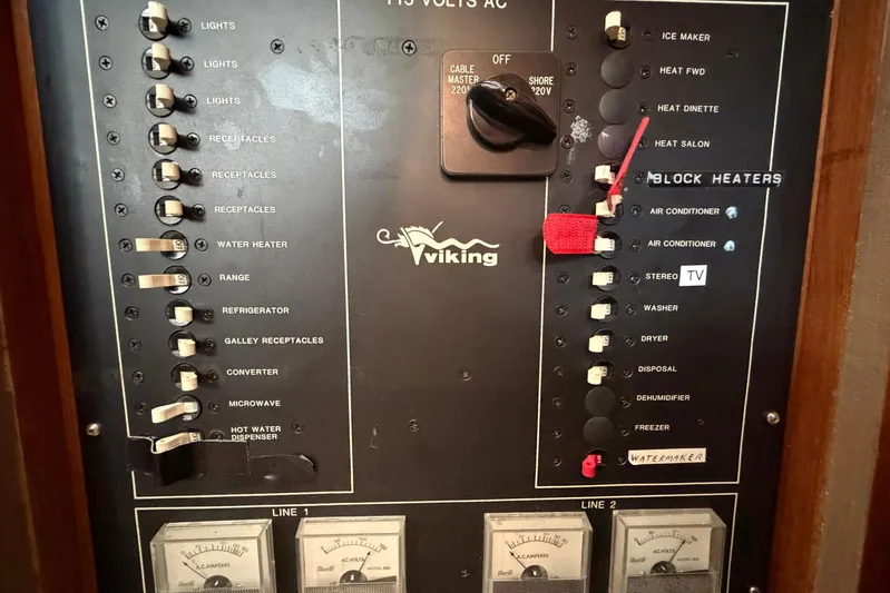 Frayed Knot Yacht Photos Pics Control panel of a 1987 Viking 44 Motor Yacht with labeled switches and meters.