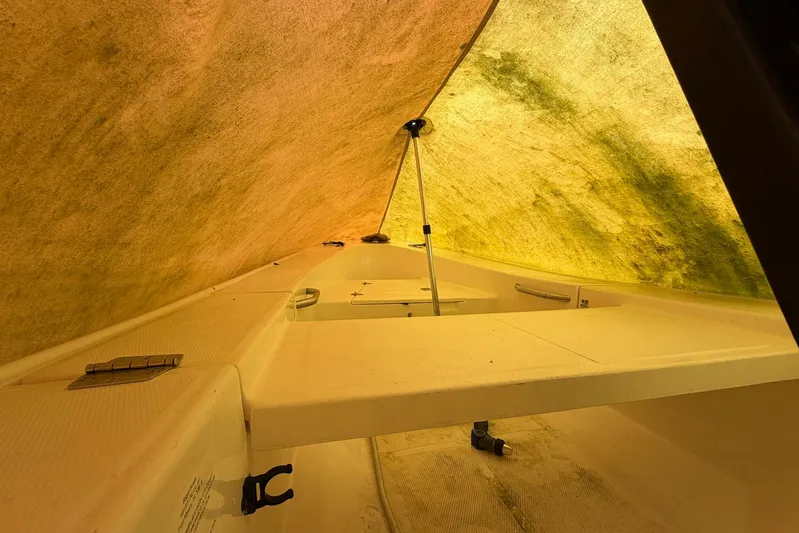 Frayed Knot Yacht Photos Pics Interior view of 1987 Viking 44 Motor Yacht under a yellow tarp.