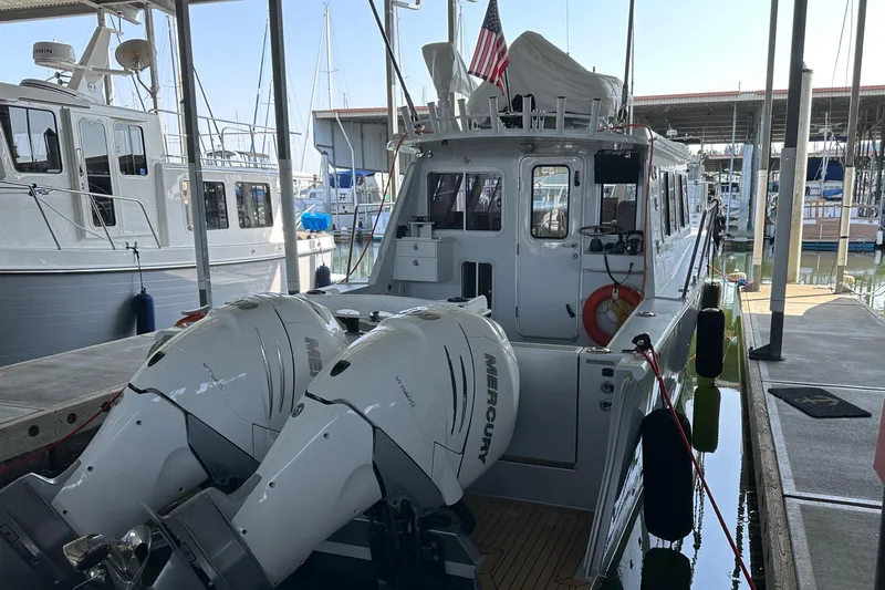 Reel Salty Yacht Photos Pics 2020 Coastal Craft 33 ProFish boat docked with twin Mercury outboard engines.