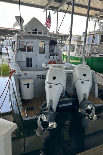 Reel Salty Yacht Photos Pics 2020 Coastal Craft 33 ProFish boat docked with dual outboard engines.