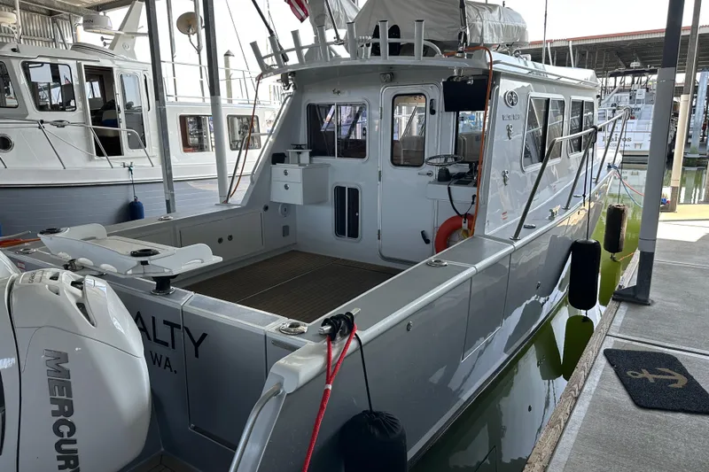 Reel Salty Yacht Photos Pics 2020 Coastal Craft 33 ProFish boat docked, featuring Mercury outboard engine.