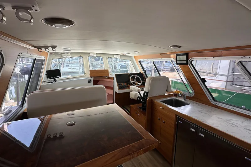 Reel Salty Yacht Photos Pics Interior of 2020 Coastal Craft 33 ProFish boat with modern helm and seating area.