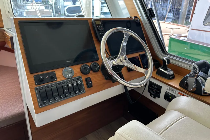Reel Salty Yacht Photos Pics 2020 Coastal Craft 33 ProFish helm with modern controls and navigation equipment.