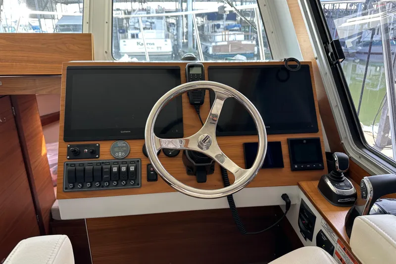 Reel Salty Yacht Photos Pics 2020 Coastal Craft 33 ProFish helm with dual screens and modern controls.