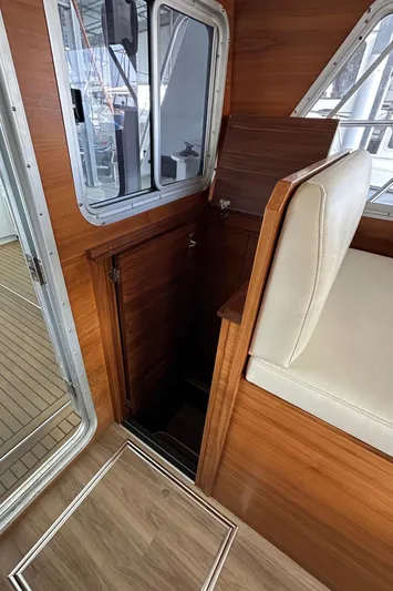 Reel Salty Yacht Photos Pics 2020 Coastal Craft 33 ProFish interior with wood finish and seating.