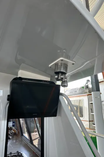 Reel Salty Yacht Photos Pics 2020 Coastal Craft 33 ProFish interior with mounted screen and equipment.
