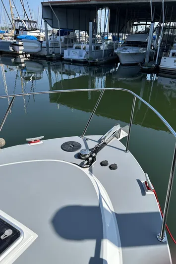 Reel Salty Yacht Photos Pics 2020 Coastal Craft 33 ProFish docked at marina, showcasing bow and anchor.