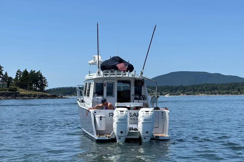 Reel Salty Yacht Photos Pics 2020 Coastal Craft 33 ProFish boat on water, scenic background, clear sky.