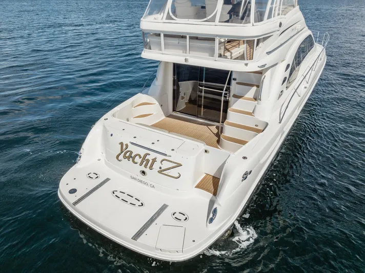  Yacht Photos Pics 2005 Sea Ray 550 Sedan Bridge yacht on water, rear view, elegant design.