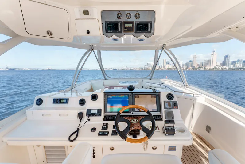 Yacht Photos Pics Helm of 2005 Sea Ray 550 Sedan Bridge yacht with city skyline view.